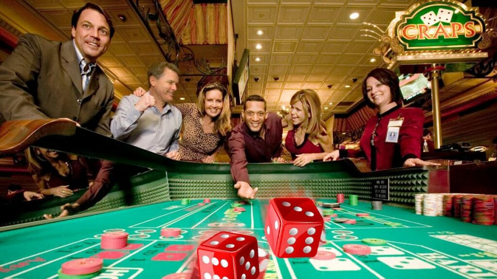 People Playing Craps at a Casino Craps Table Red Dices